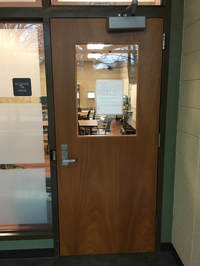 Picture of a classroom door I have had many classes in.